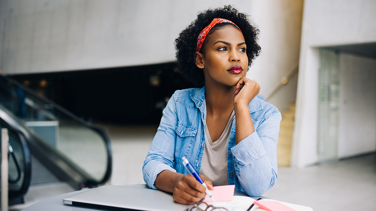 Young Black woman deep in thought