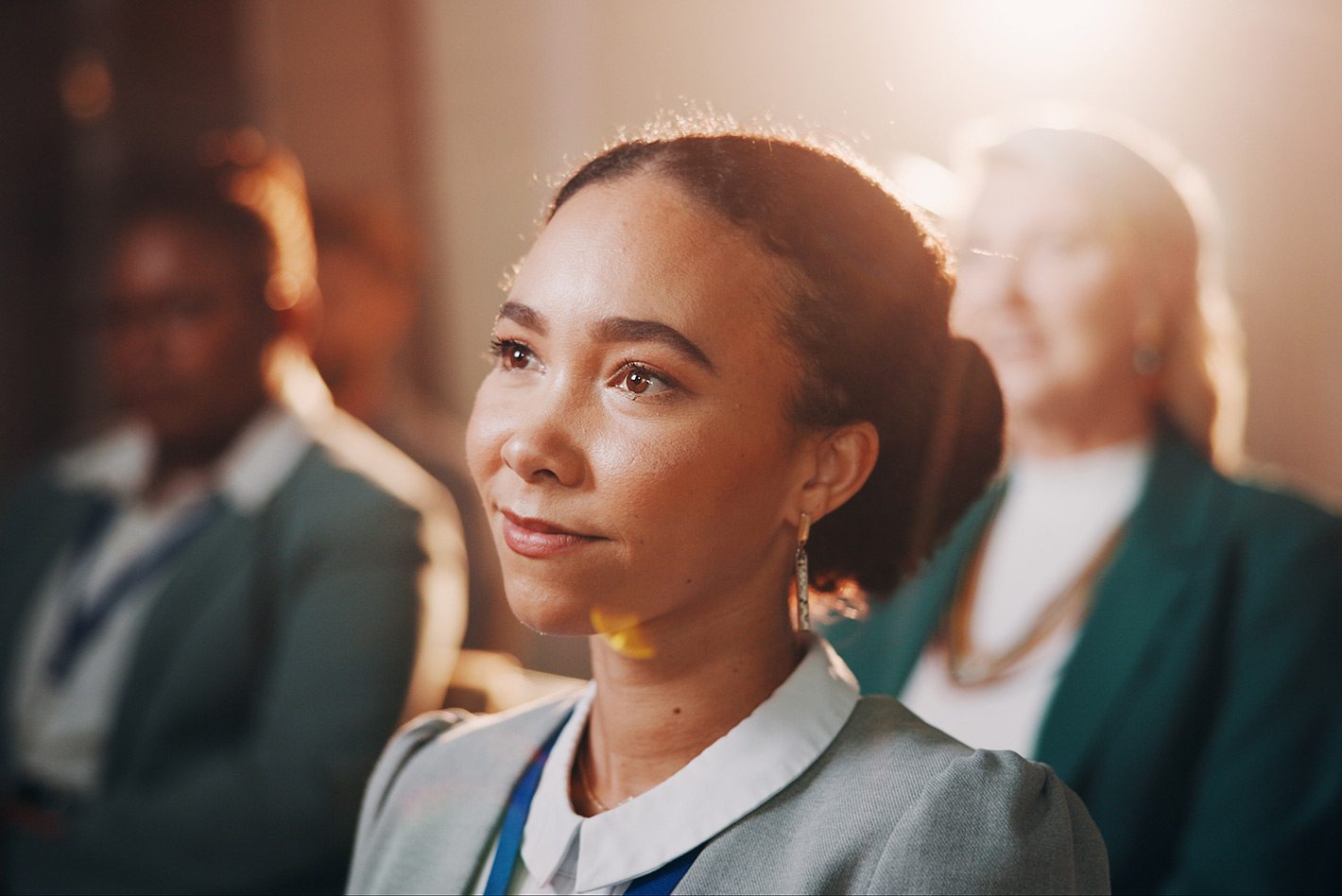 Young woman listening attentively during a business conference