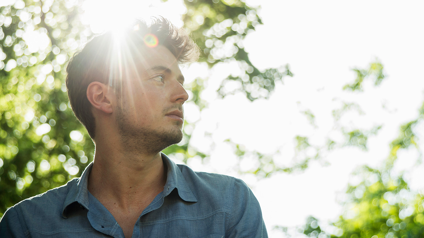 Man contemplating on a sunny day